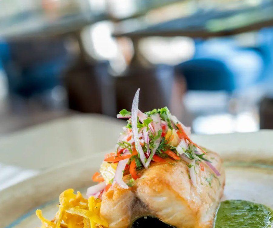 A plated fish dish with fresh slaw at the hotel restaurant